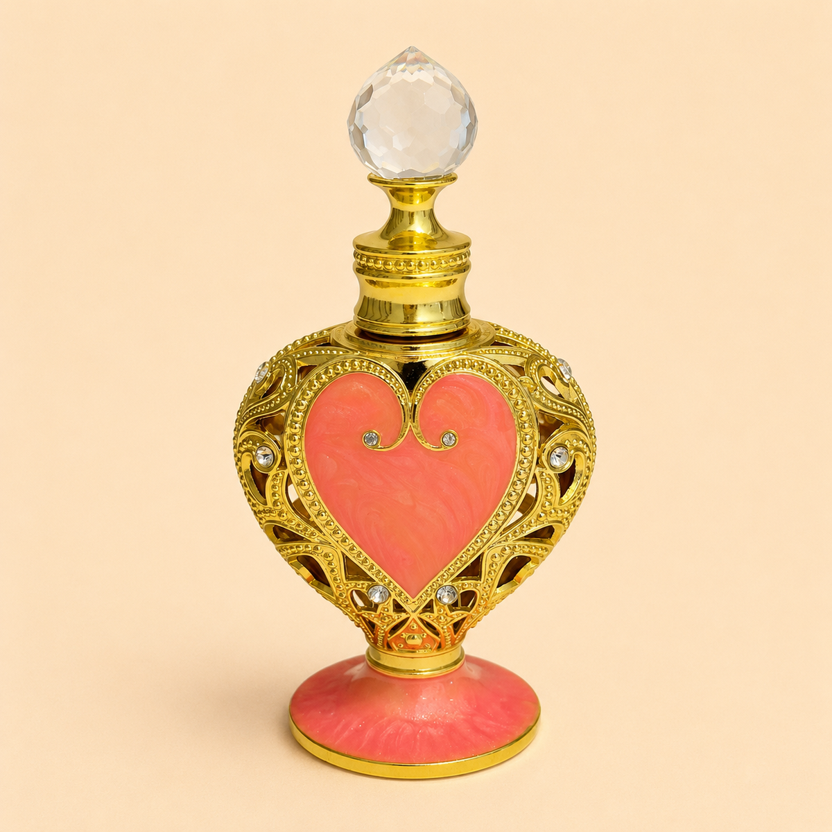 Elixir em óleo Perfume da Sereia Rubria em frasco ornamental dourado com coração rosa claro, sobre fundo bege, perfume natural concentrado de luxo.